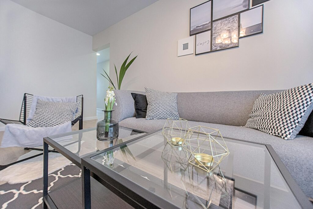 A stylish and comfortable living room featuring modern geometric decor and contemporary design elements.