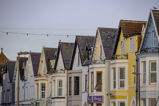 Colorful row houses in Blackpool, showcasing Edwardian architecture during a serene day.