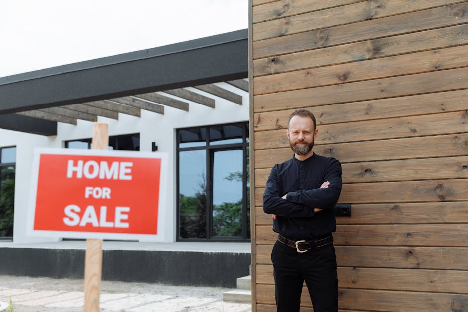 Real estate agent standing by a modern home with a 'Home for Sale' sign.