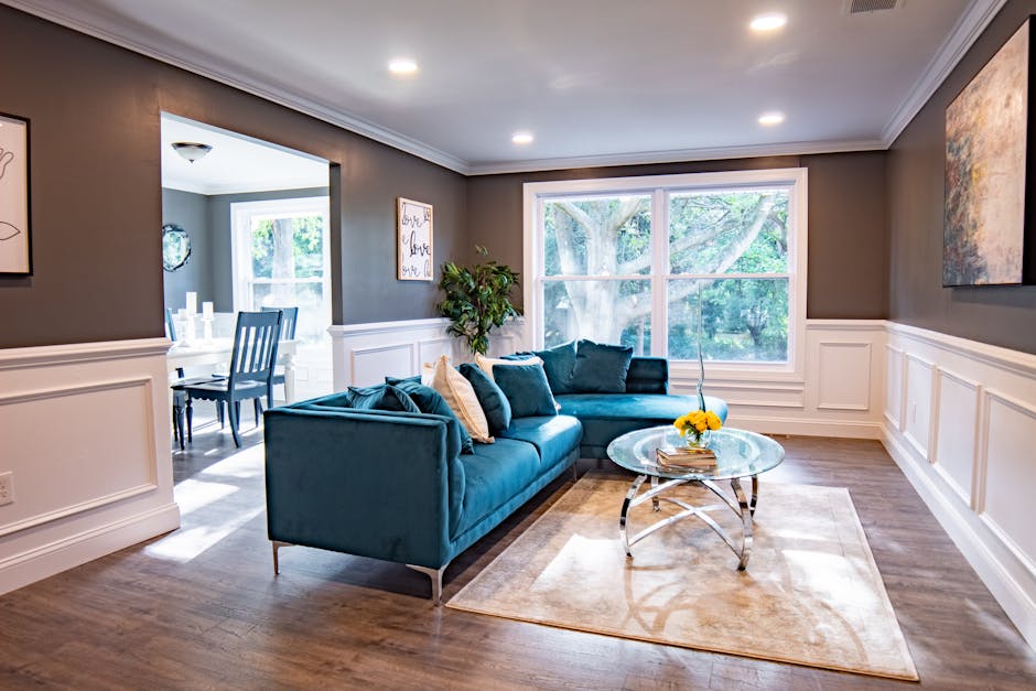 Bright modern living room featuring a turquoise sofa and a stylish decor.